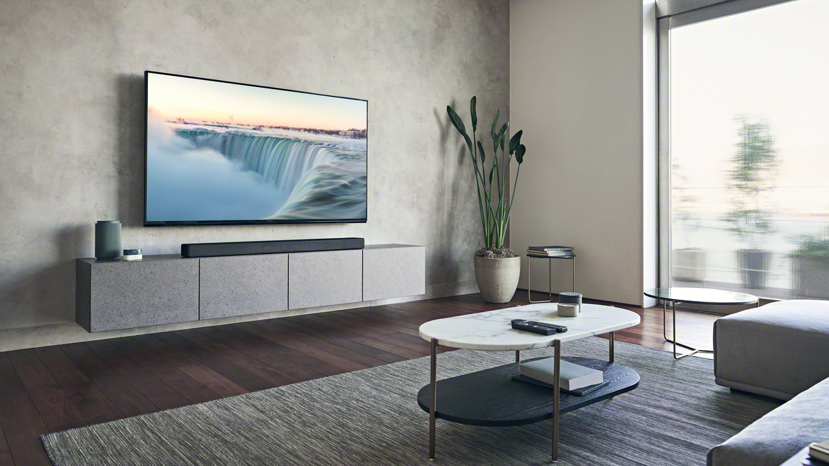 the sony ht-a7000 soundbar below a TV in a stylish living room