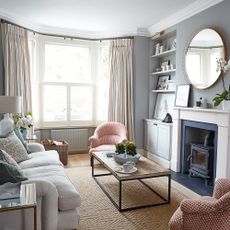 Soft grey and pink living room in a small Victorian home