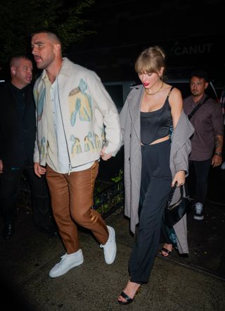Travis Kelce and Taylor Swift are seen leaving the SNL after party on October 15, 2023 in New York, New York.