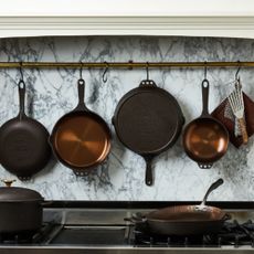 Smithey ironware pans on a marble kitchen