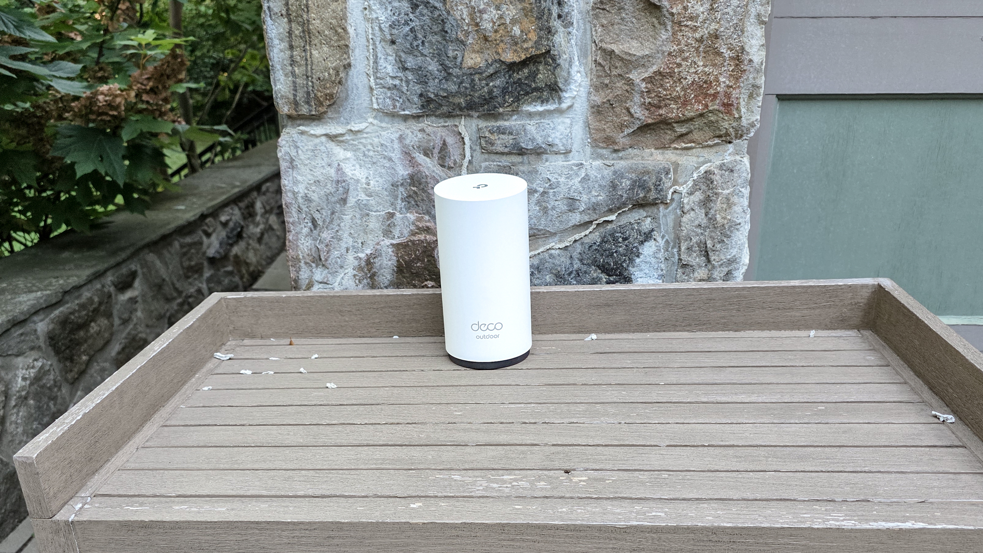 TP-Link Deco BE65-Outdoor on a shelf outside