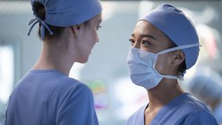 Jules Millin (Adelaide Kane) and Mika Yasuda (Midori Francis) share a moment before Mika goes into surgery on Grey's Anatomy Season 21.