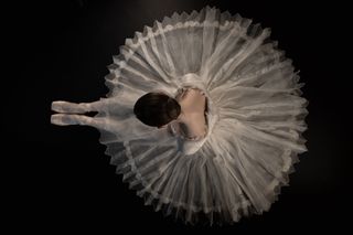 Delia Mathews: A ballerina at the Birmingham Royal Ballet captured from a graphic overhead angle