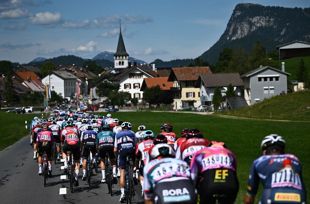 The pack of riders cycles during the 8th stage of the 109th edition of the of the Tour de France cycling race 1863 km between Dole in eastern France and Lausanne in Switzerland on July 9 2022 Photo by AnneChristine POUJOULAT AFP Photo by ANNECHRISTINE POUJOULATAFP via Getty Images