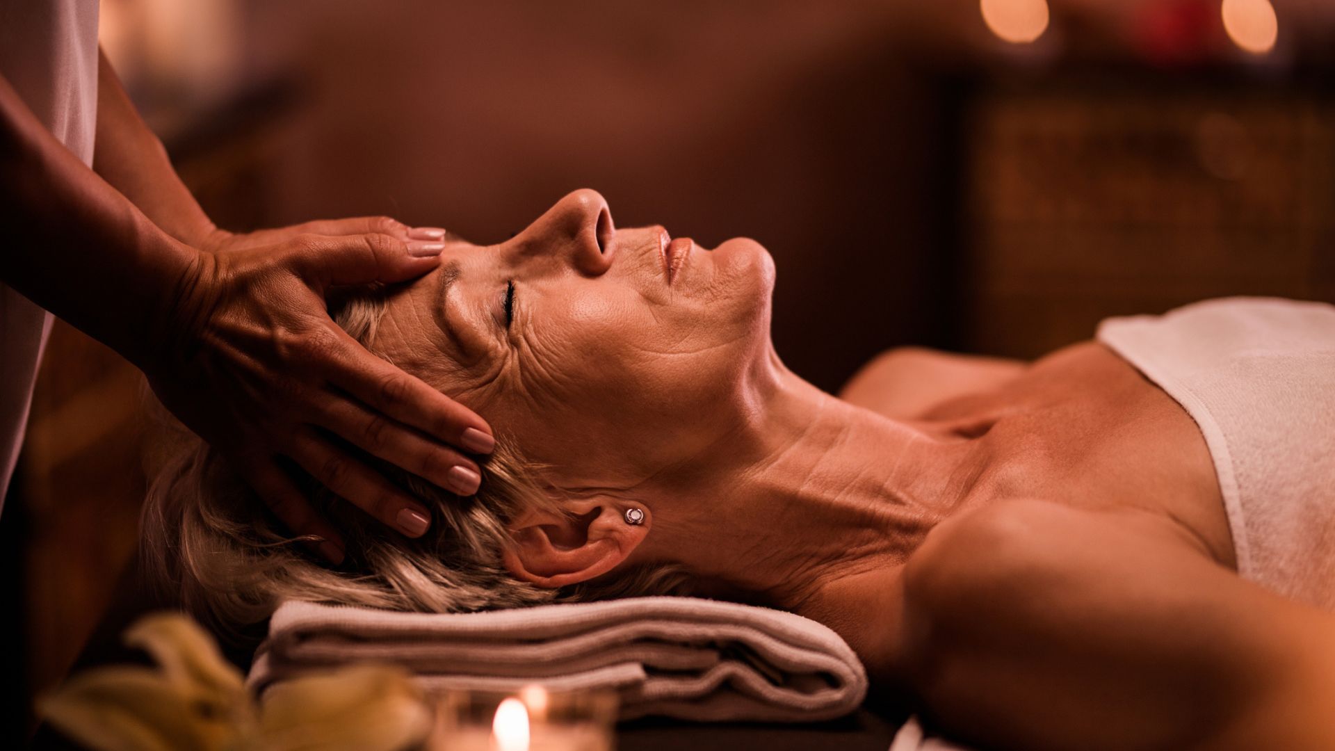 A woman enjoying a head massage