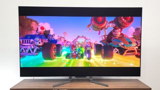 LG OLED evo M3 TV shown in living room with Super Mario Bros movie on screen