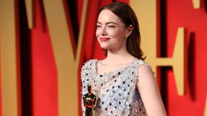 Emma Stone attends the 2024 Oscars wearing a sparkly dress