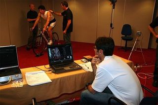 Julich watches while Andy Pruitt and Scott Holz discuss Cancellara's position.