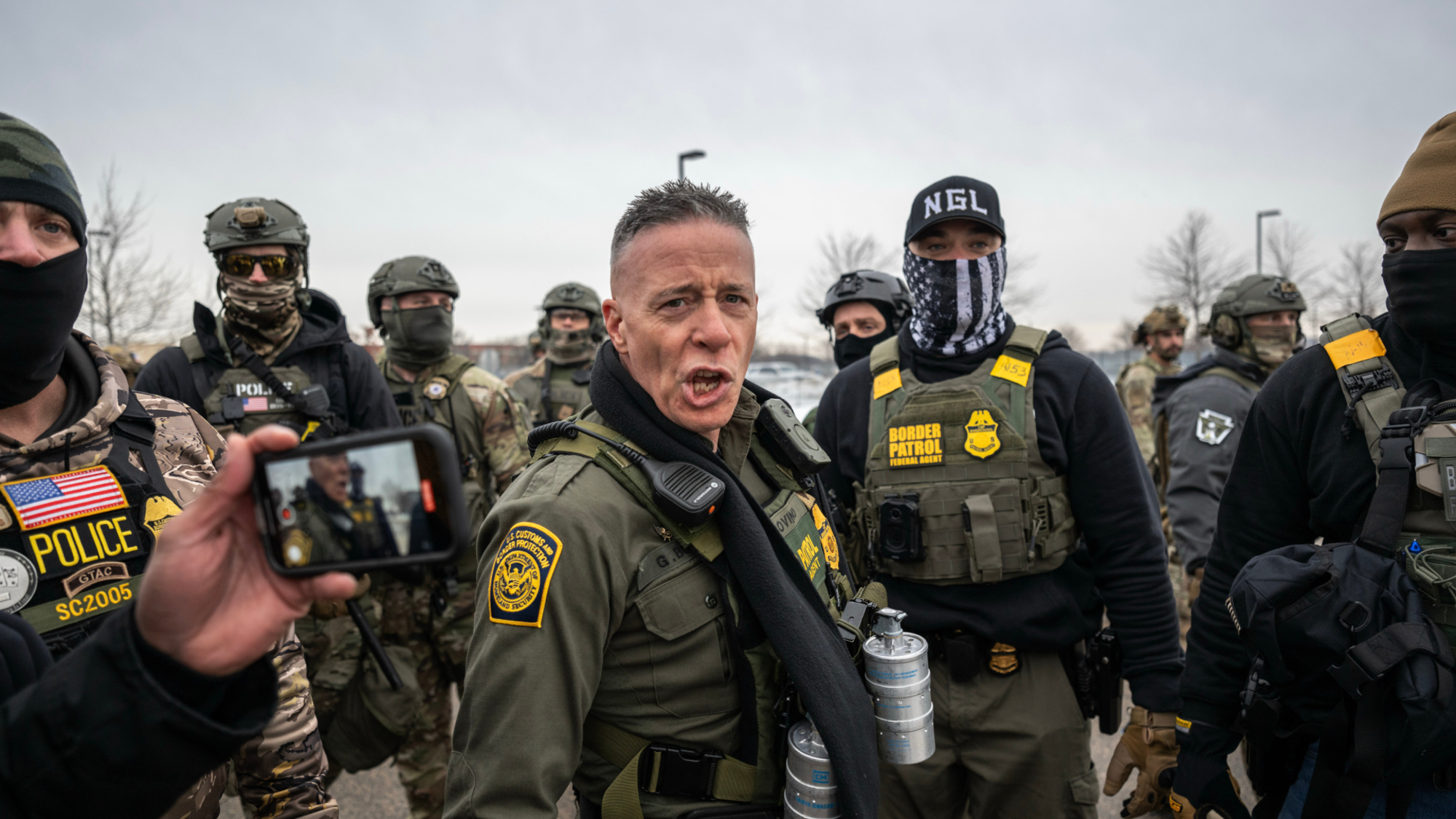 Border Patrol Chief Gregory Bovino, center, and law enforcement officers outside the Bishop Henry Whipple Federal Building in St. Paul, Minnesota, US, on Thursday, Jan. 8, 2026. An Immigration and Customs Enforcement officer fatally shot a woman during a confrontation in Minneapolis, sparking an uproar over the presence of ICE agents in the city and heightening political divisions around the Trump administration's migrant crackdown. Photographer: Victor J. Blue/Bloomberg via Getty Images