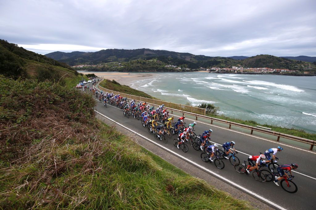 MALLABIA SPAIN APRIL 08 James Knox of United Kingdom and Team QuickStep Alpha Vinyl Enric Mas Nicolau of Spain and Movistar Team Rubn Fernandez Andujar of Spain and Team Cofidis Hugo Houle of Canada and Team Israel Premier Tech Adam Yates of United Kingdom and Team INEOS Grenadiers and a general view of the peloton passing through the seaside during the 61st Itzulia Basque Country 2022 Stage 5 a 1638km stage from Zamudio to Mallabia 305m itzulia WorldTour on April 08 2022 in Mallabia Spain Photo by Gonzalo Arroyo MorenoGetty Images