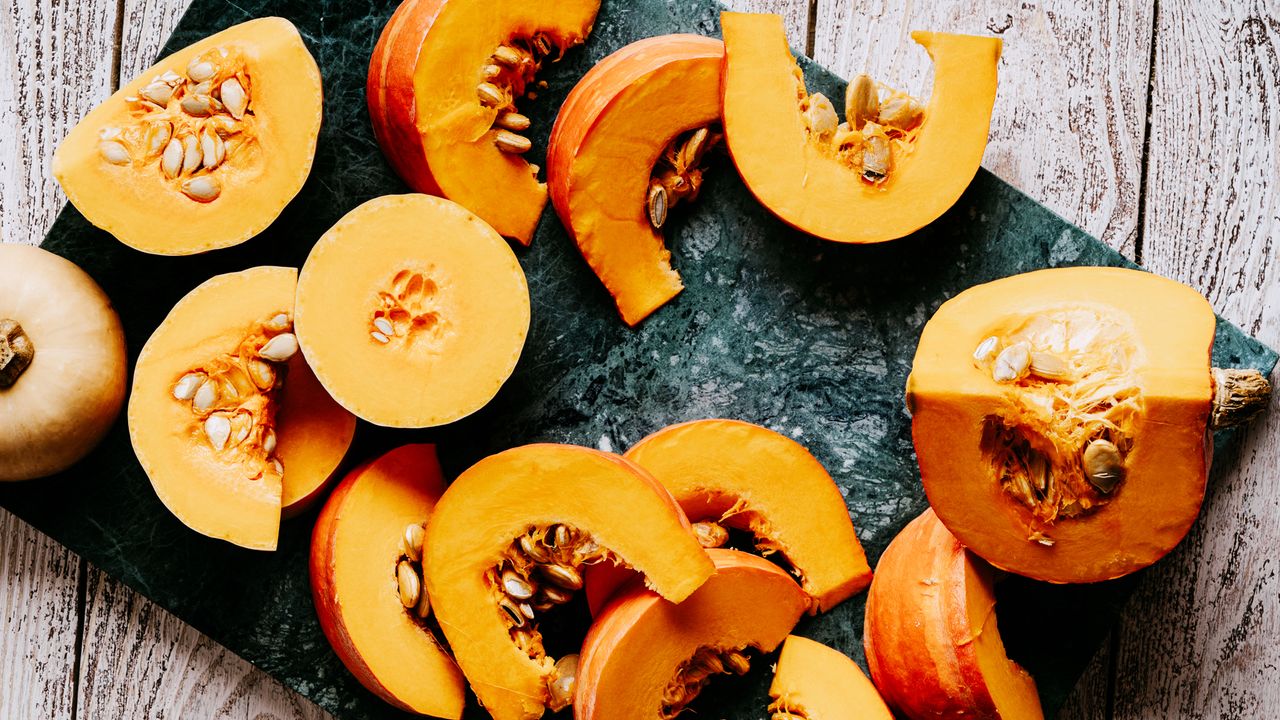 Pumpkin chopped up on a slate surface