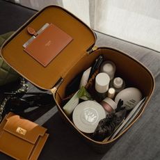 Photo of skincare and makeup products in a cosmetic bag