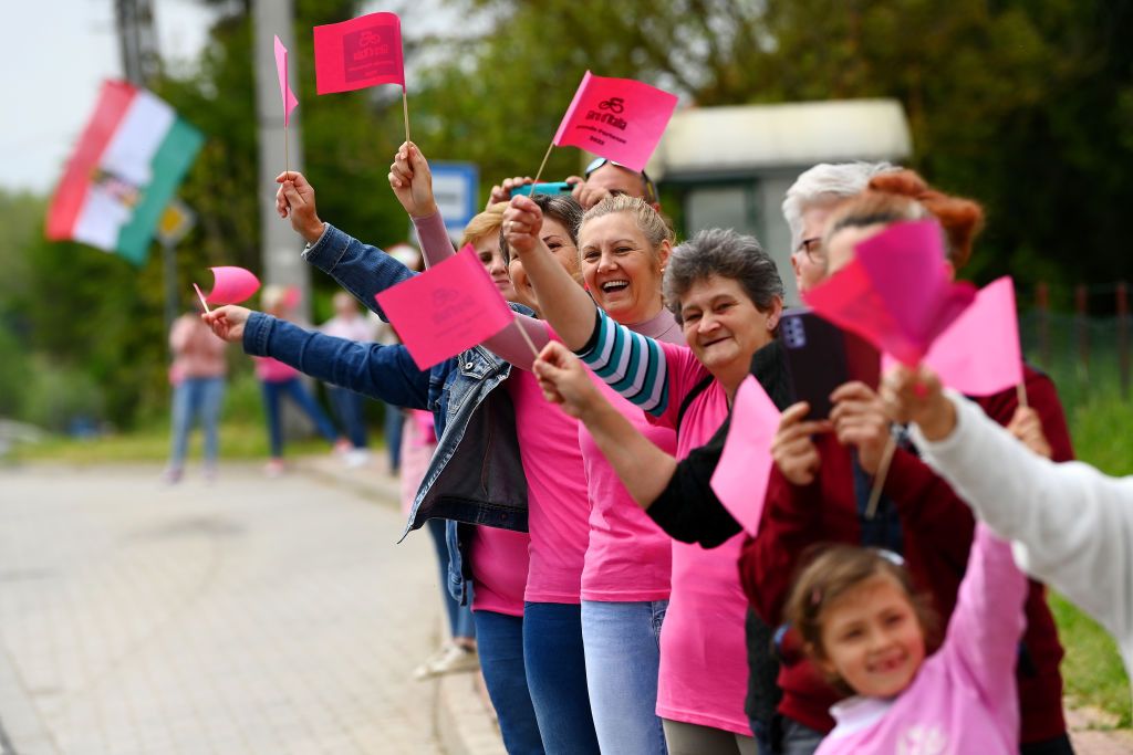 BALATONFURED HUNGARY MAY 08 Fans dressed in pink wait for the peloton to pass during the 105th Giro dItalia 2022 Stage 3 a 201km stage from Kaposvr to Balatonfred Giro WorldTour on May 08 2022 in Balatonfured Hungary Photo by Tim de WaeleGetty Images