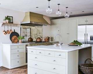 Traditional kitchen with wood cabinet and gold extractor hood