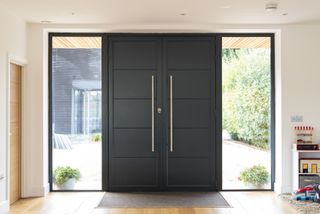 an aluminium front door with sidelights