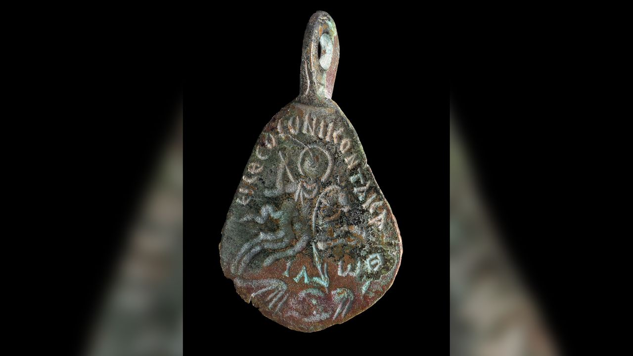 The front of the amulet is inscribed with Greek letters for the Jewish name of God and shows a rider on a horse spearing a prone figure.