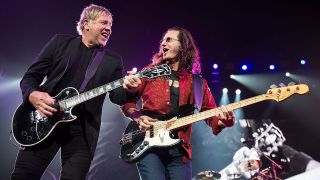 Alex Lifeson (L) and Geddy Lee of Rush perform in concert at The Frank Erwin Center on April 23, 2013 in Austin, Texas. 