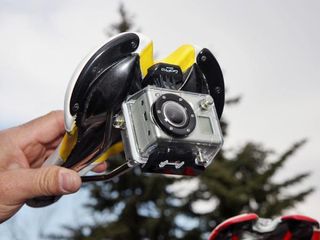 Dean Dealy of GoPro was busy fitting a number of team bikes with custom mounts for the company's tiny video cameras, such as this one that hangs inconspicuously below an SRM computer.