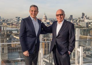 Disney chairman and CEO Bob Iger (l.) and Fox’s Rupert Murdoch inked a deal that will transform both media empires.