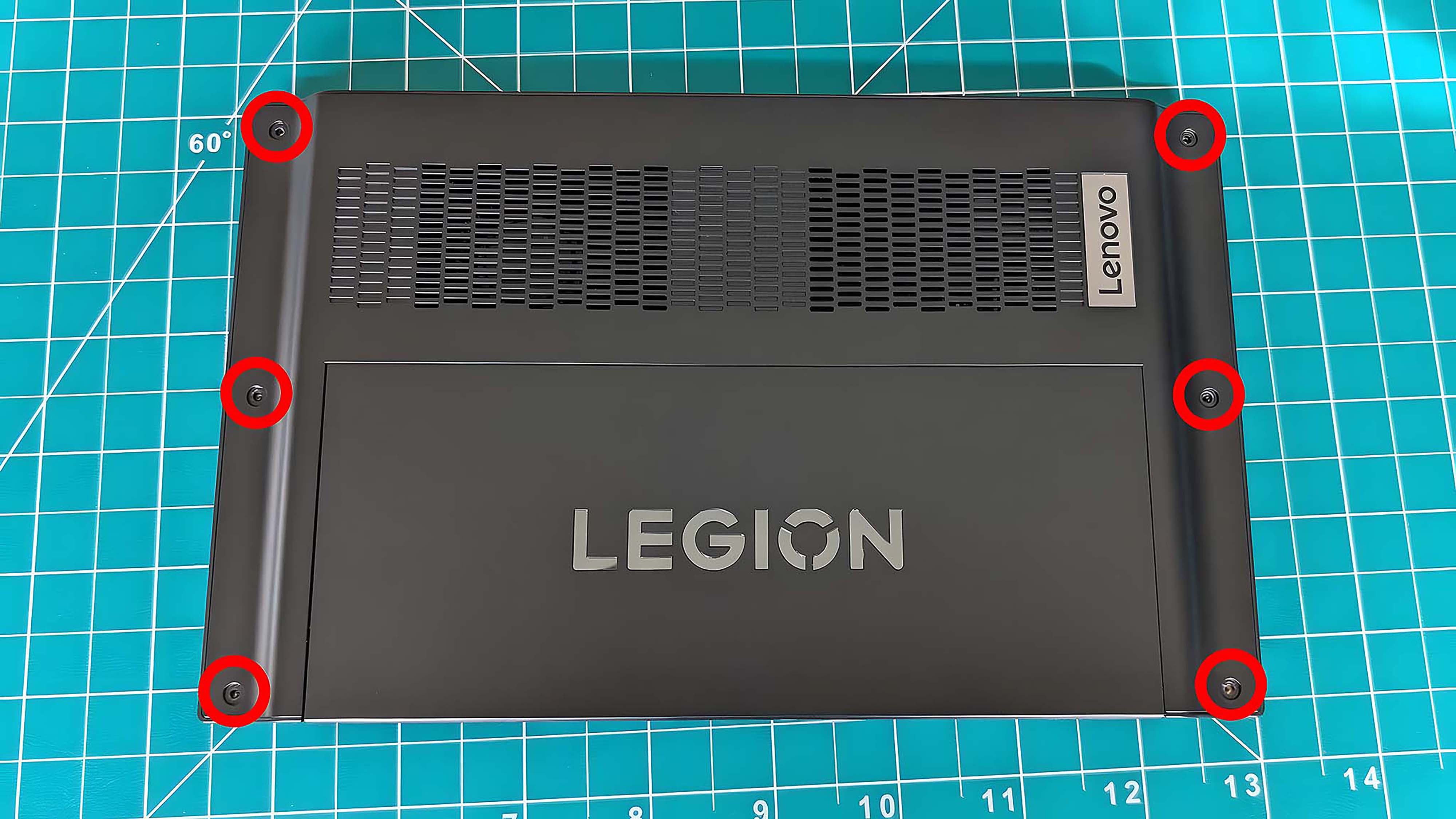 The back side of the Lenovo Legion Go with all six screws highlighted by a red circle.