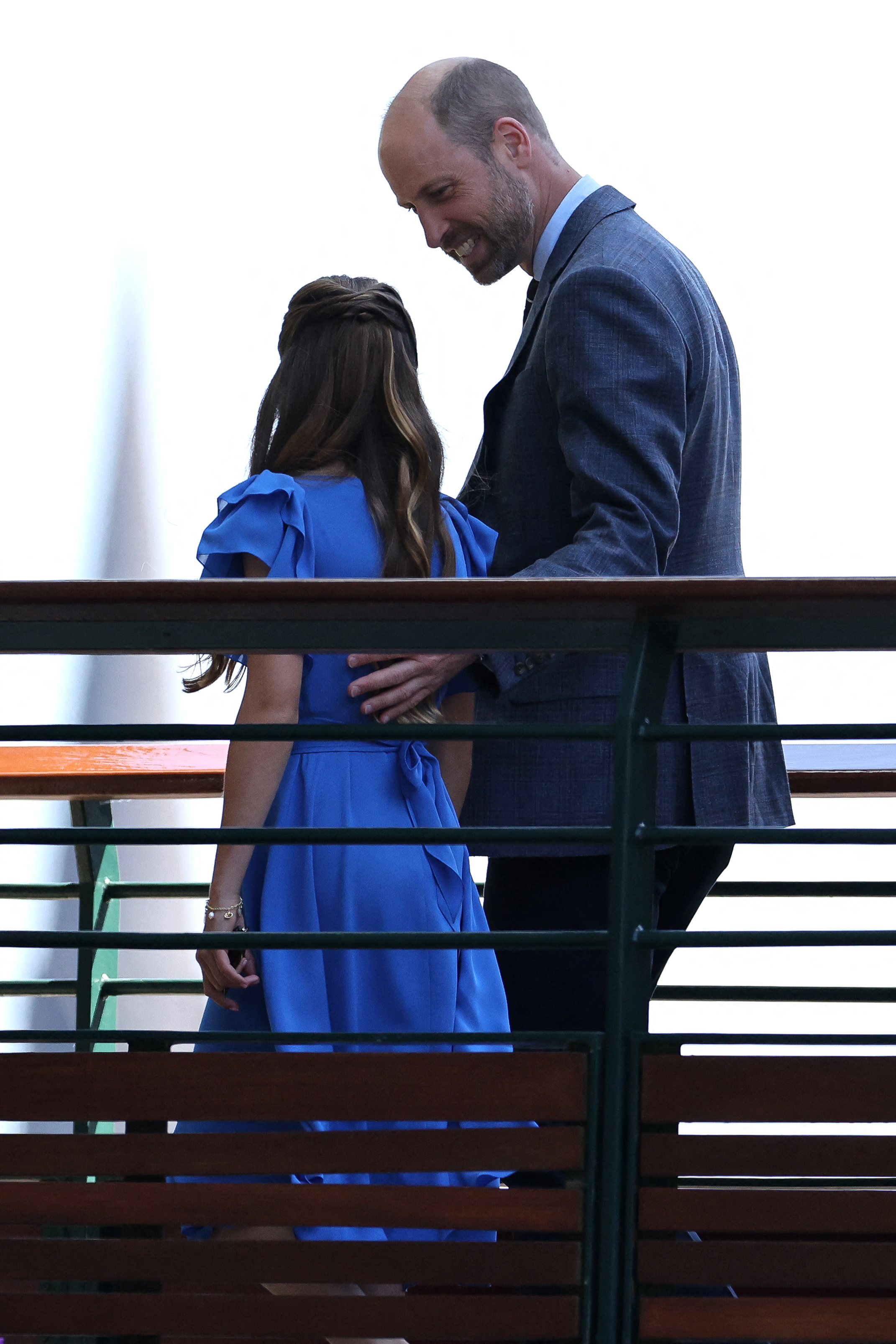Prince William wears a suit to attend Wimbledon 2026 where he reassures his children, Prince George and Princess Charlotte, as they're met by crowds of people