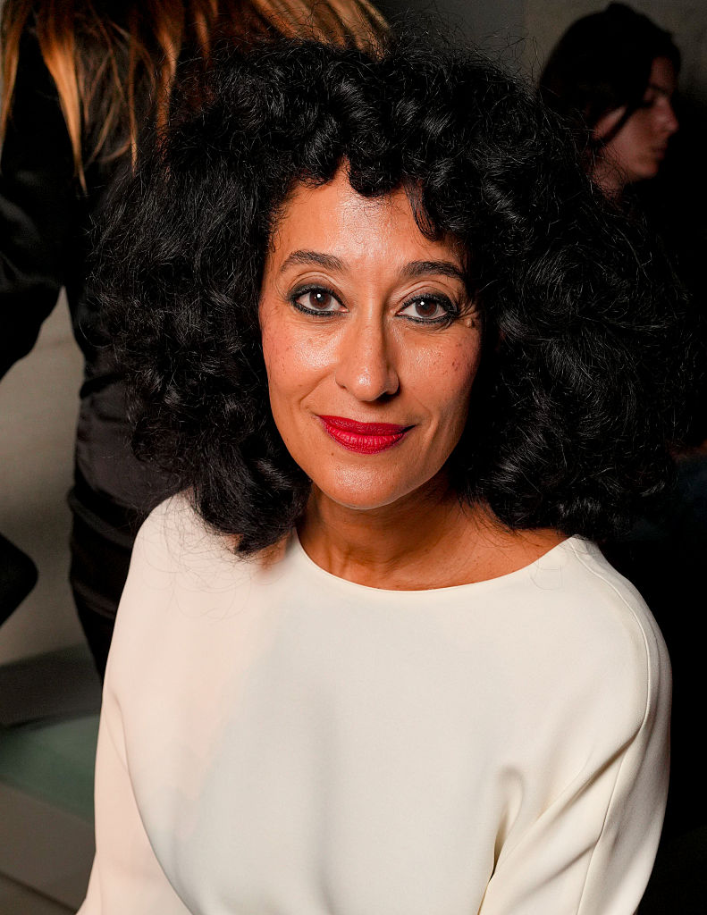 Tracee Ellis Ross at Balenciaga with a curly hairstyle in a white boat neck sweater
