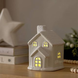 small white light-up ceramic house