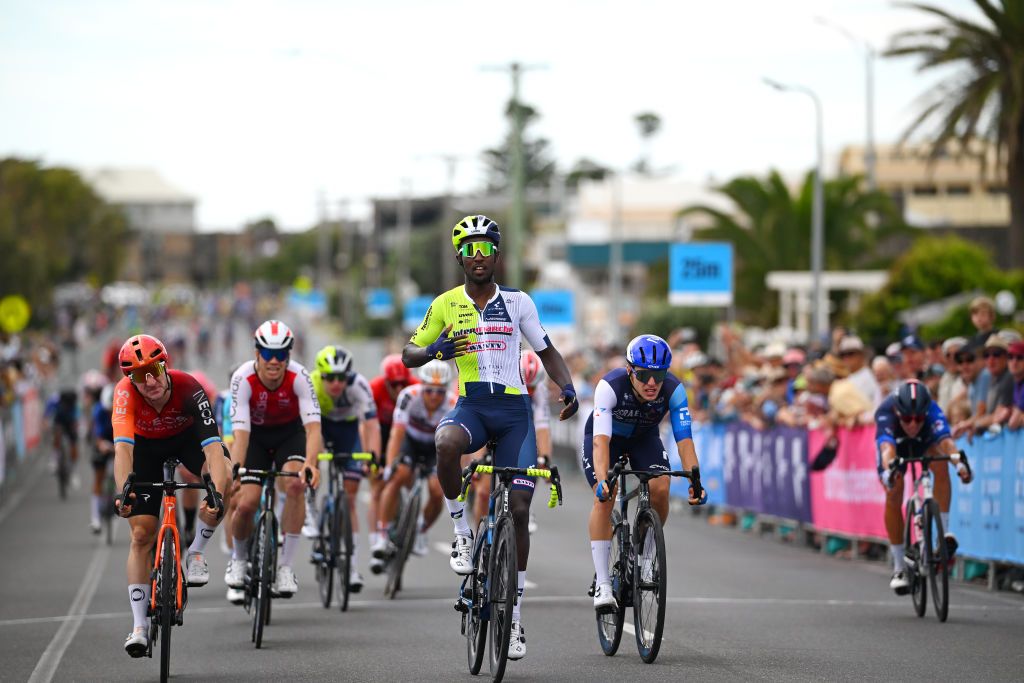 TORQUAY AUSTRALIA JANUARY 25 Biniam Girmay of Eritrea and Team IntermarcheWanty celebrates at finish line as race winner ahead of Elia Viviani of Italy and Team INEOS Grenadiers and Corbin Strong of New Zealand and Team IsraelPremier Tech during the 2nd Surf Coast Classic 2024 Mens Elite a 155km one day race from Lorne to Torquay on January 25 2024 in Torquay Australia Photo by Tim de WaeleGetty Images