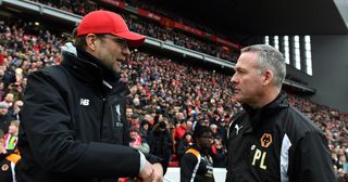 Jurgen Klopp manager / head coach of Liverpool and Paul Lambert manager / head coach of Wolverhampton Wanderers during The Emirates FA Cup Fourth Round between Liverpool and Wolverhampton Wanderers at Anfield on January 28, 2017 in Liverpool, England.