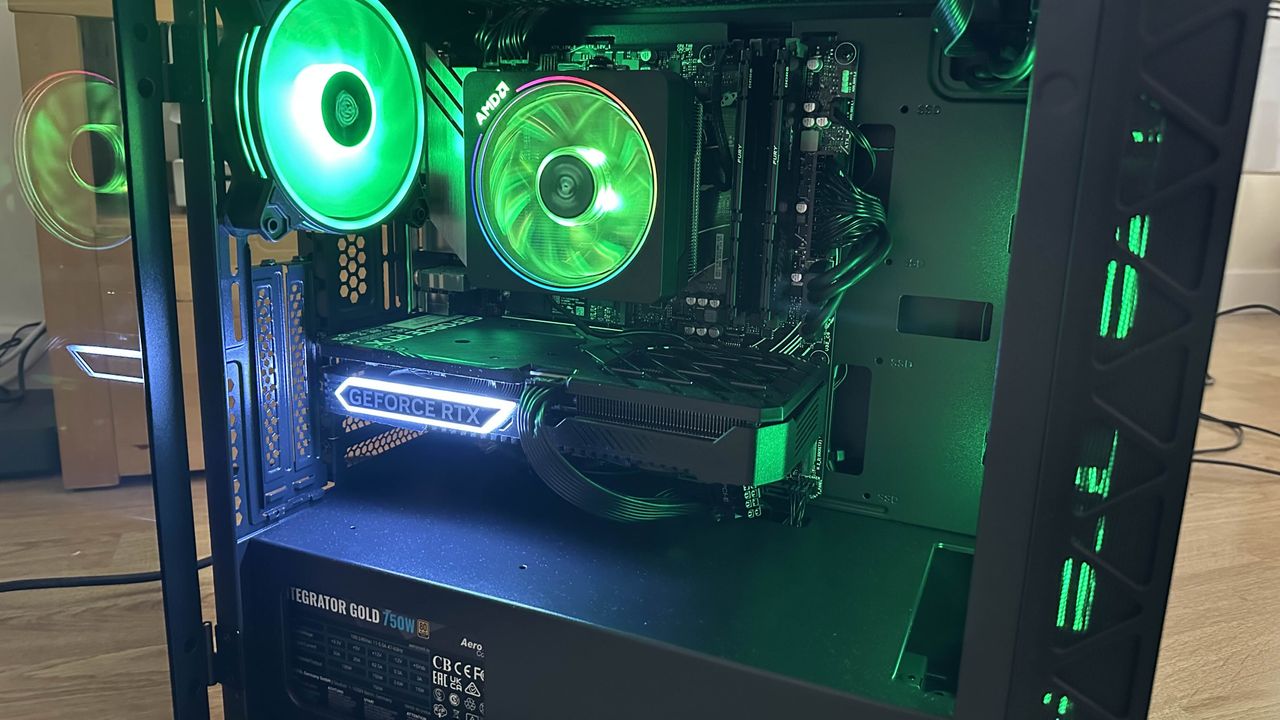 The inside of a refract gaming Jade PC, with green lighting on