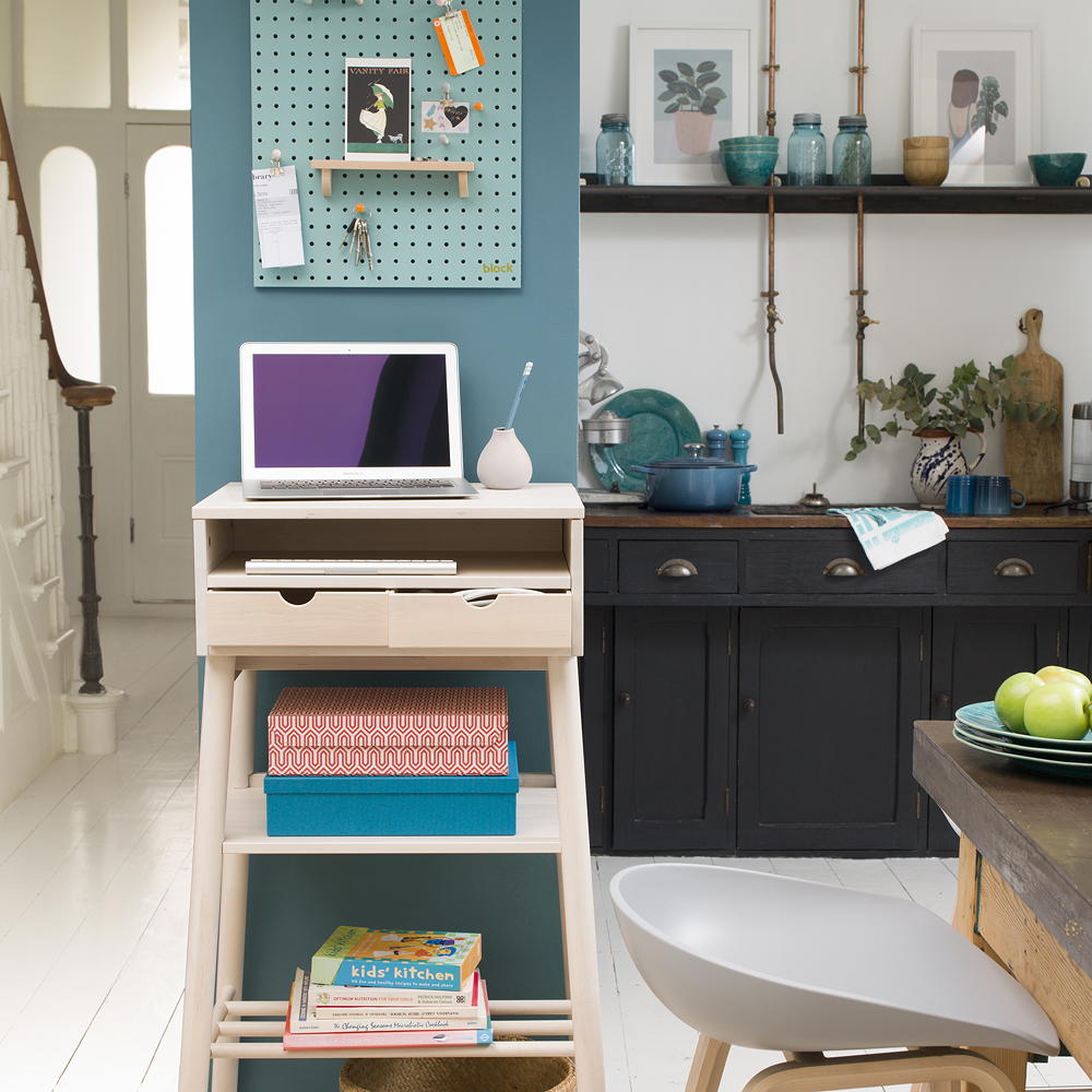 laptop on table near white chair