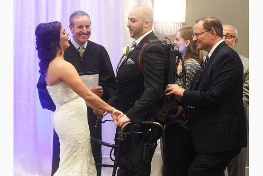 Robotic exoskeleton allows paralyzed man to walk down the aisle at his wedding