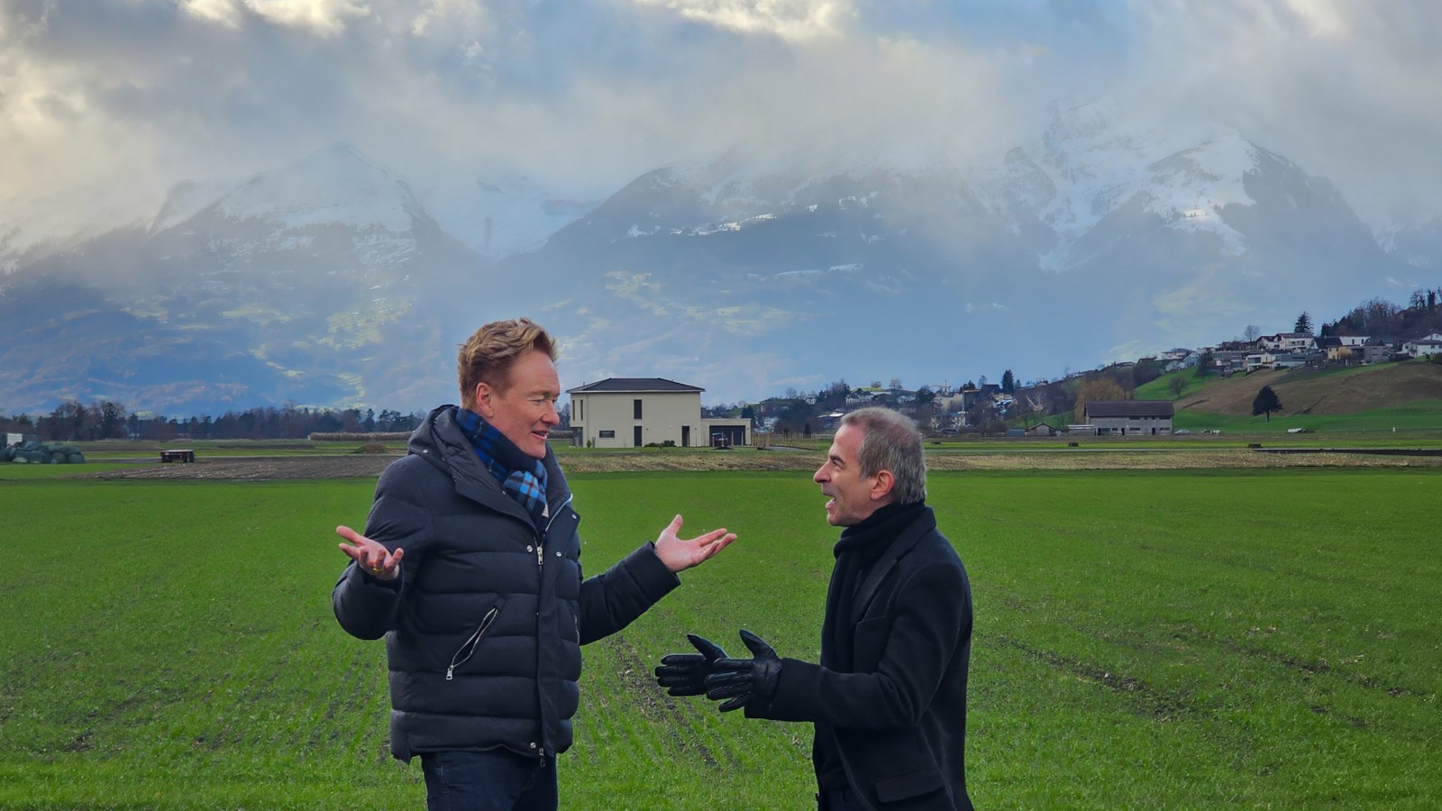 Conan O'Brien and Jordan Schlansky arguing in an Austrian field on Conan O'Brien Must Go