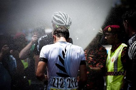 James Williamson (New Zealand National Team) welcomes the customary 'Langkawi shower' after the stage finish in Melaka.