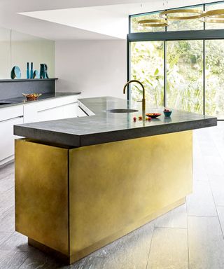 Modern kitchen with gold lacquer island and