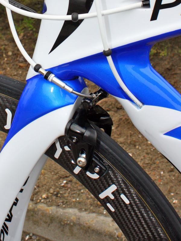 The front brake is tucked in behind the bulbous fork crown.