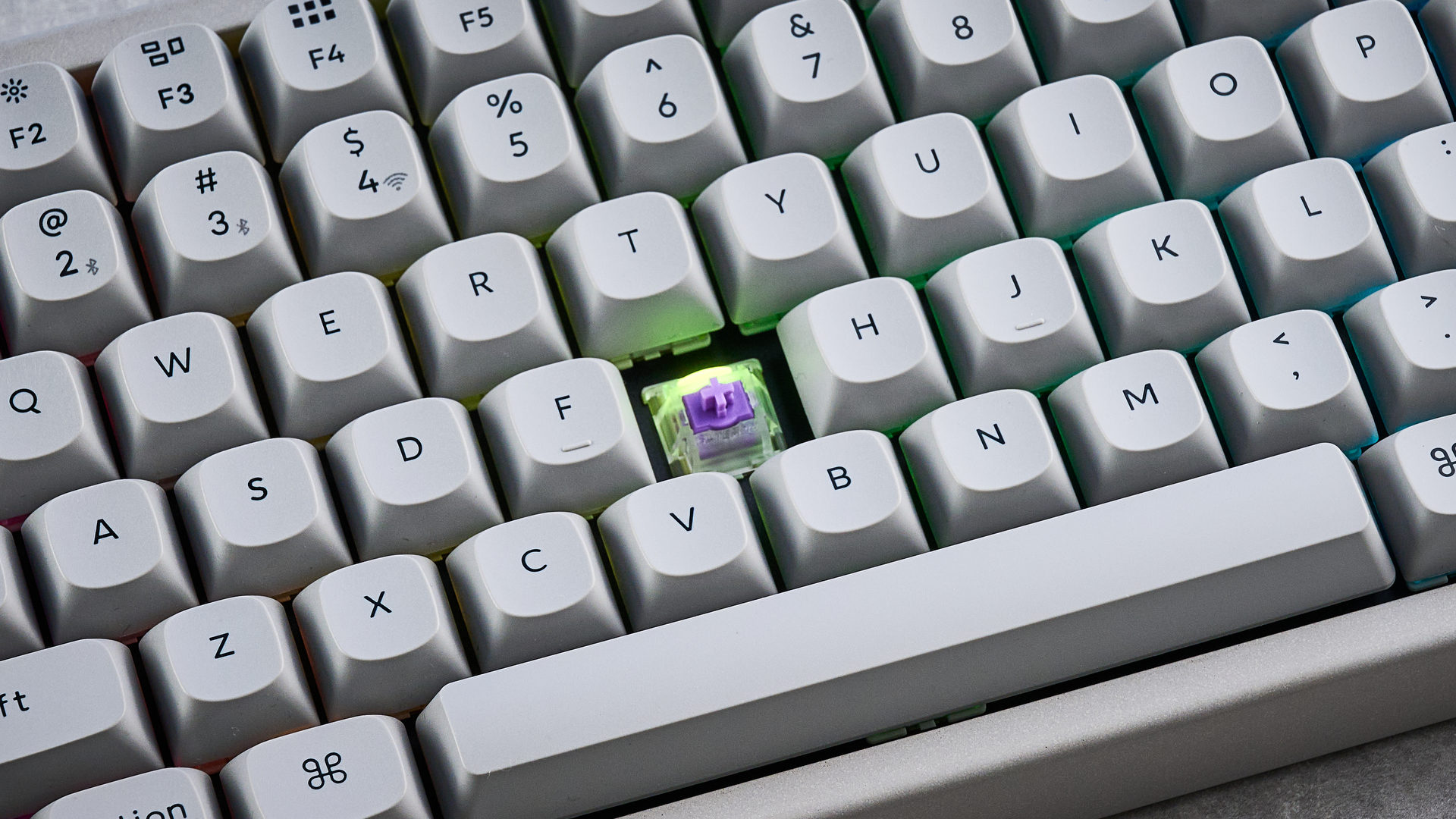 The Keychron K2 HE in concrete, on a stone surface.