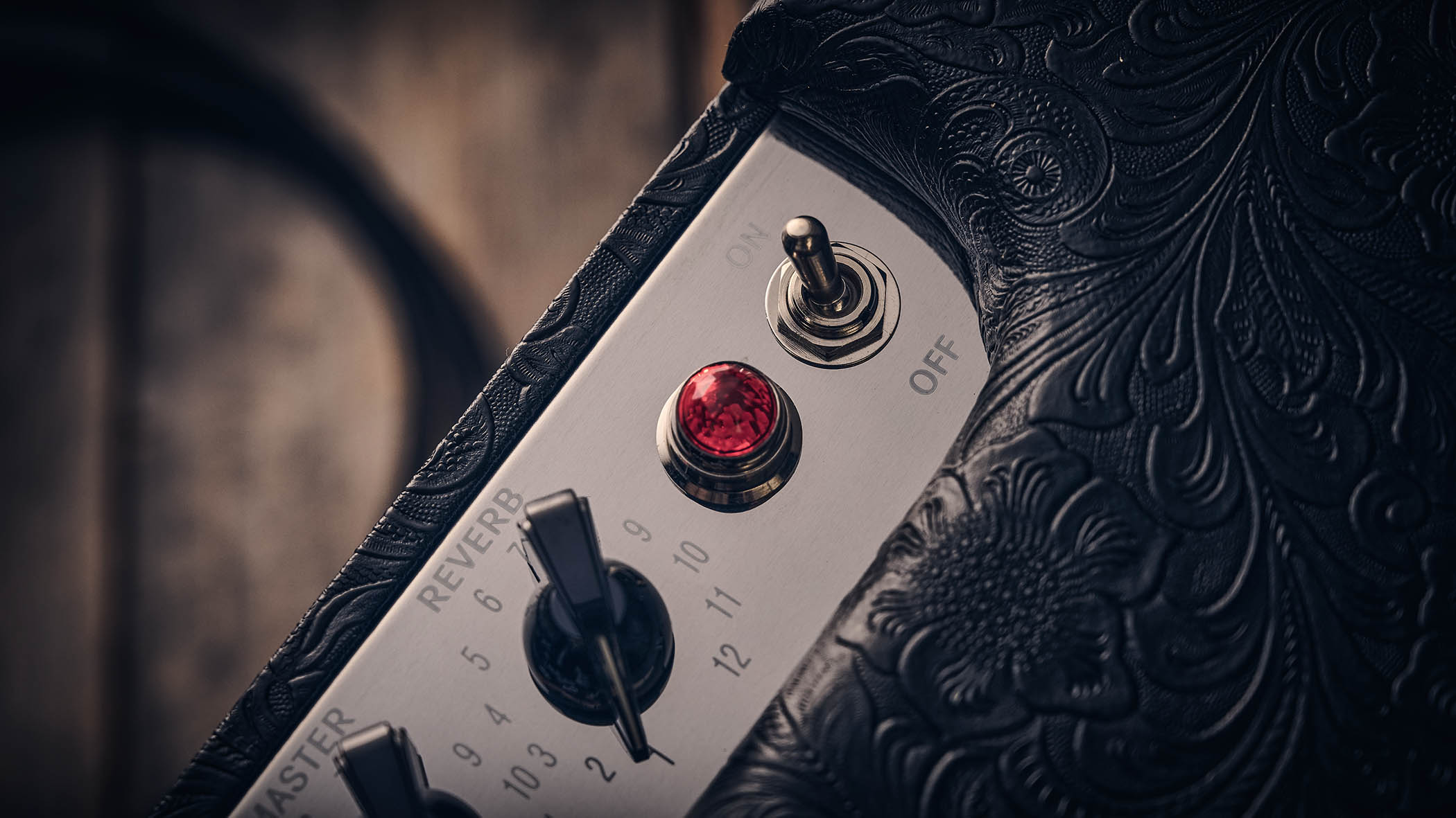 Fender Blues Junior IV 30th Anniversary: the classic combo is refinished with a touch of cowboy western flair, and is here photographed against some weathered floorboards in close-up