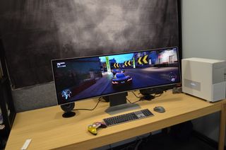 Samsung Odyssey OLED G9 ultrawide curved monitor showing a game in on-screen during our tests