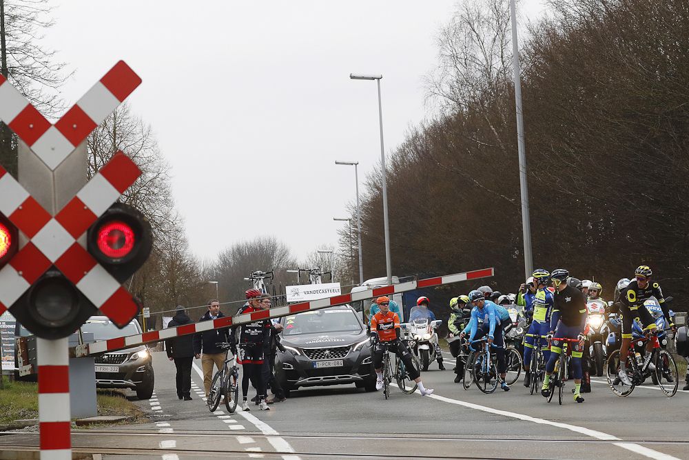 A train crossing stops the race momentarily