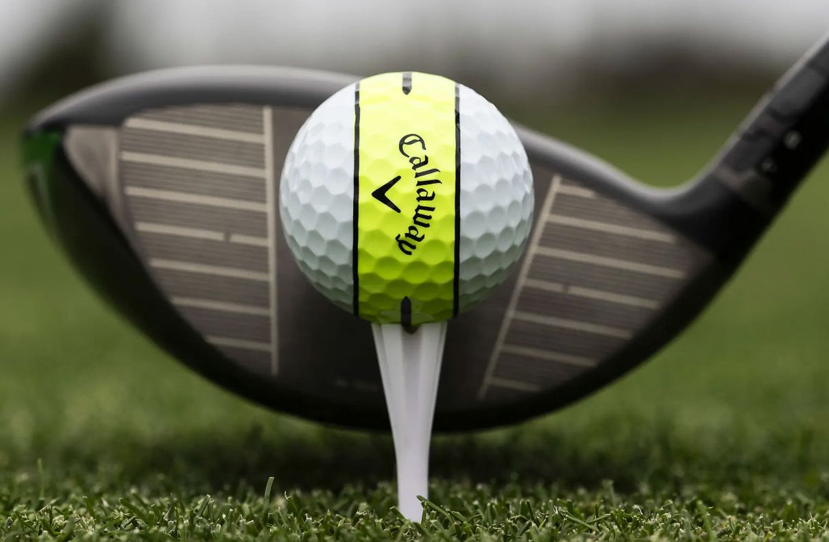 A Callaway Chrome Soft 360 ball on a golf tee with driver behind
