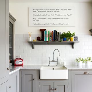 kitchen room with metro tiles and shelves with marble worktop and sink