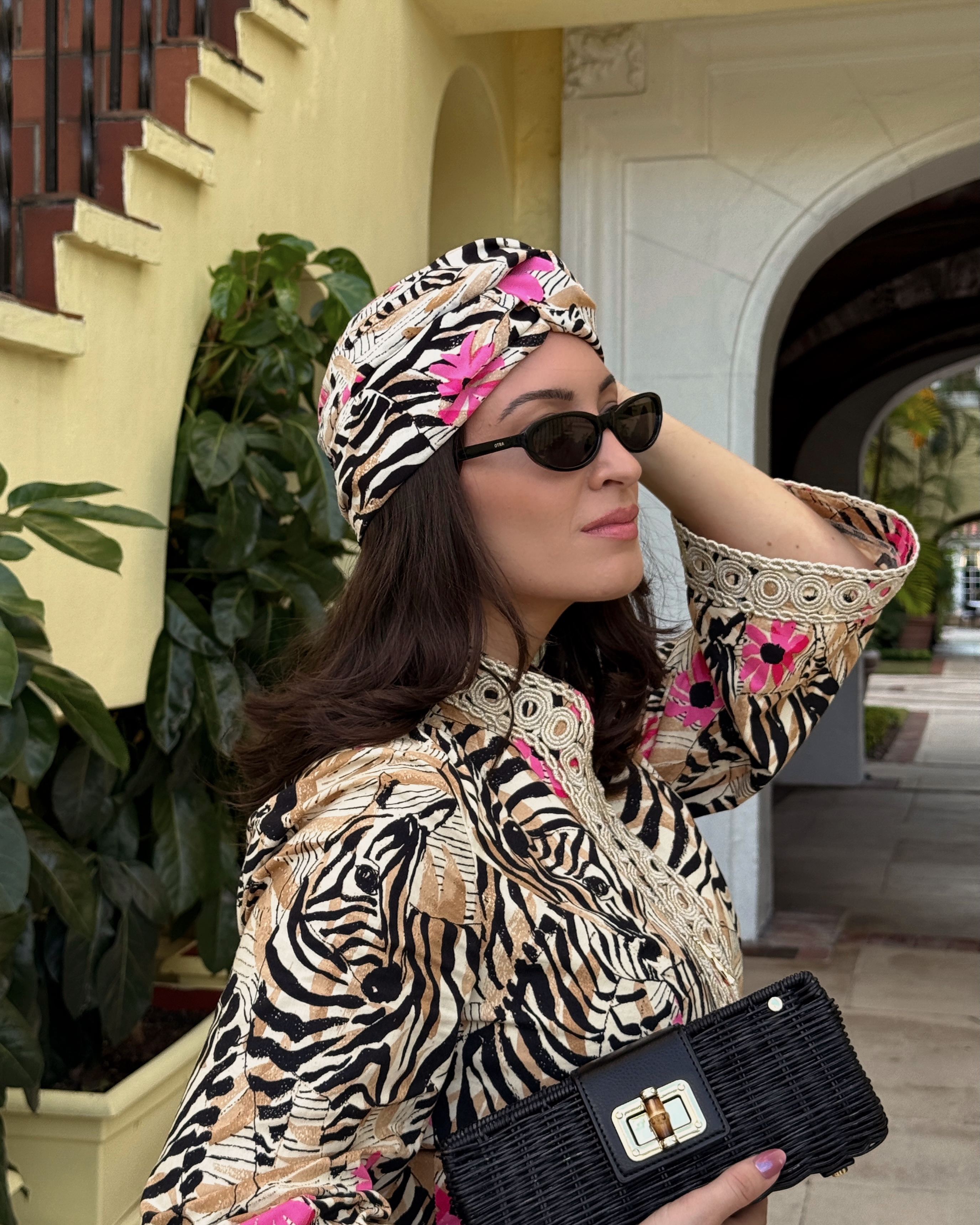 Bella Gerard wearing a headwrap and matching caftan while on vacation in Florida