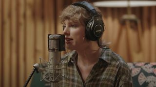 Taylor Swift singing into a microphone in the Long Pond Studio Sessions.