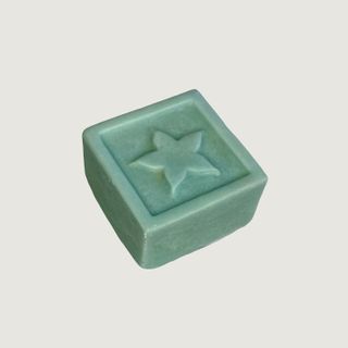 A green Clarity StarBars shampoo bar