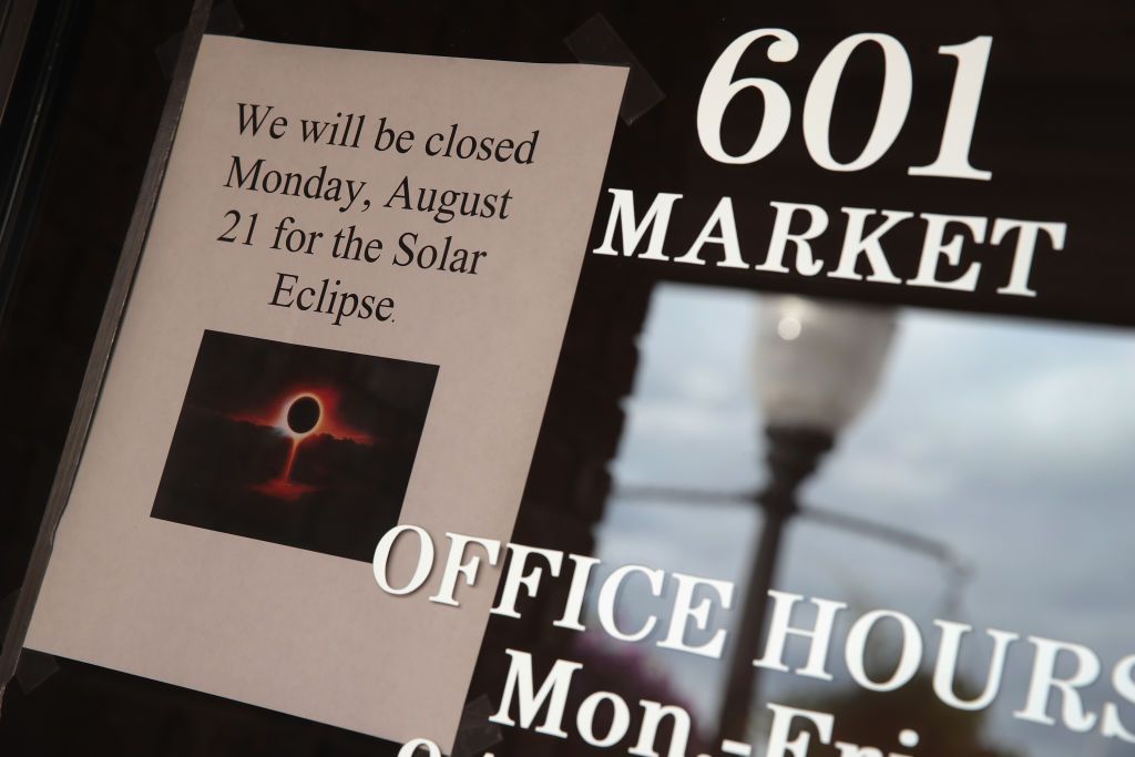 A sign in the window of a business in Metropolis, Illinois, tells visitors they will be closed on August 31 for the solar eclipse.