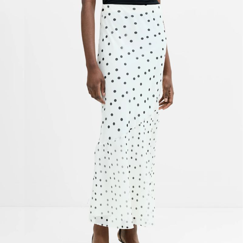 Polka dot two piece top and skirt outfit on a model