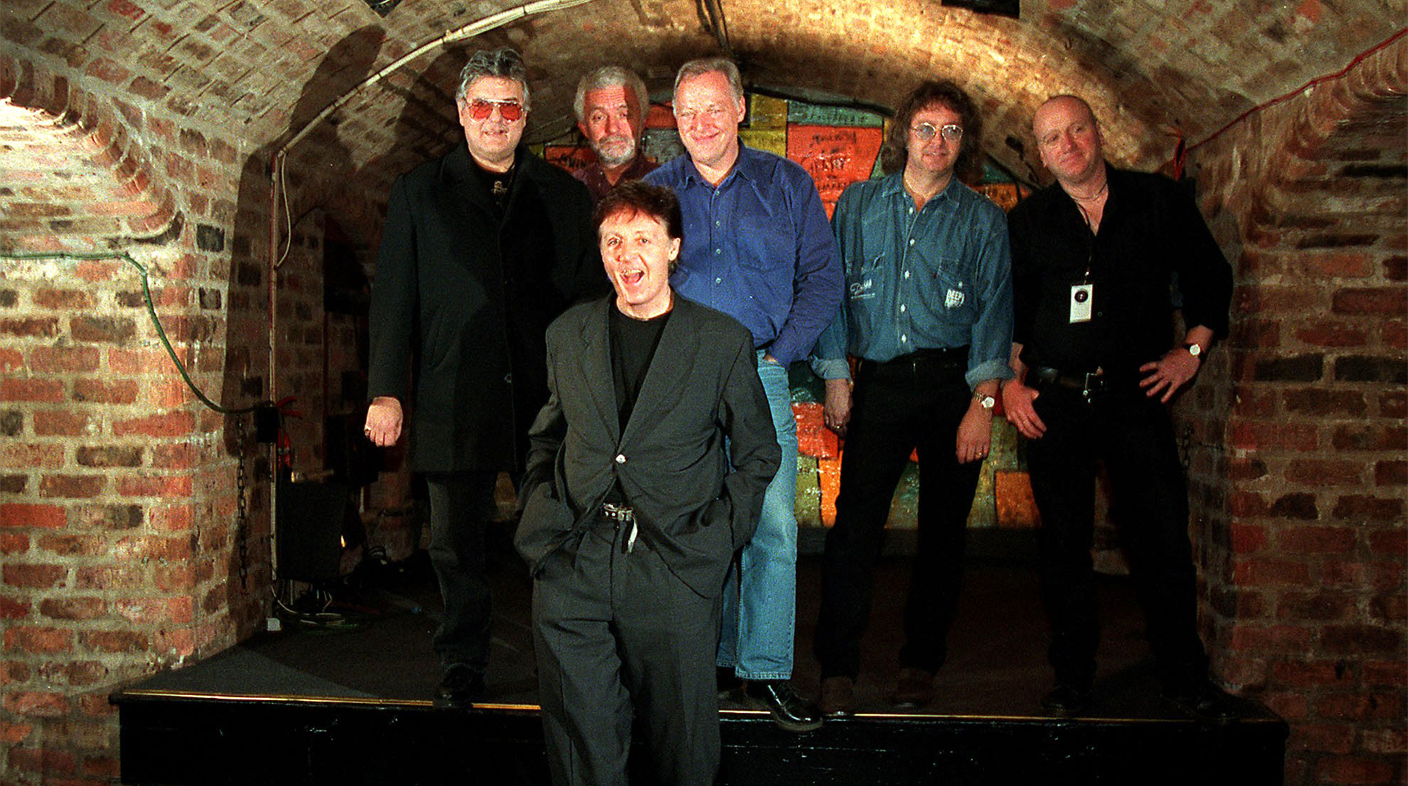 Paul McCartney poses with his Run Devil Run band (including David Gilmour center back) at the Cavern Club in Liverpool, December 14, 1999.