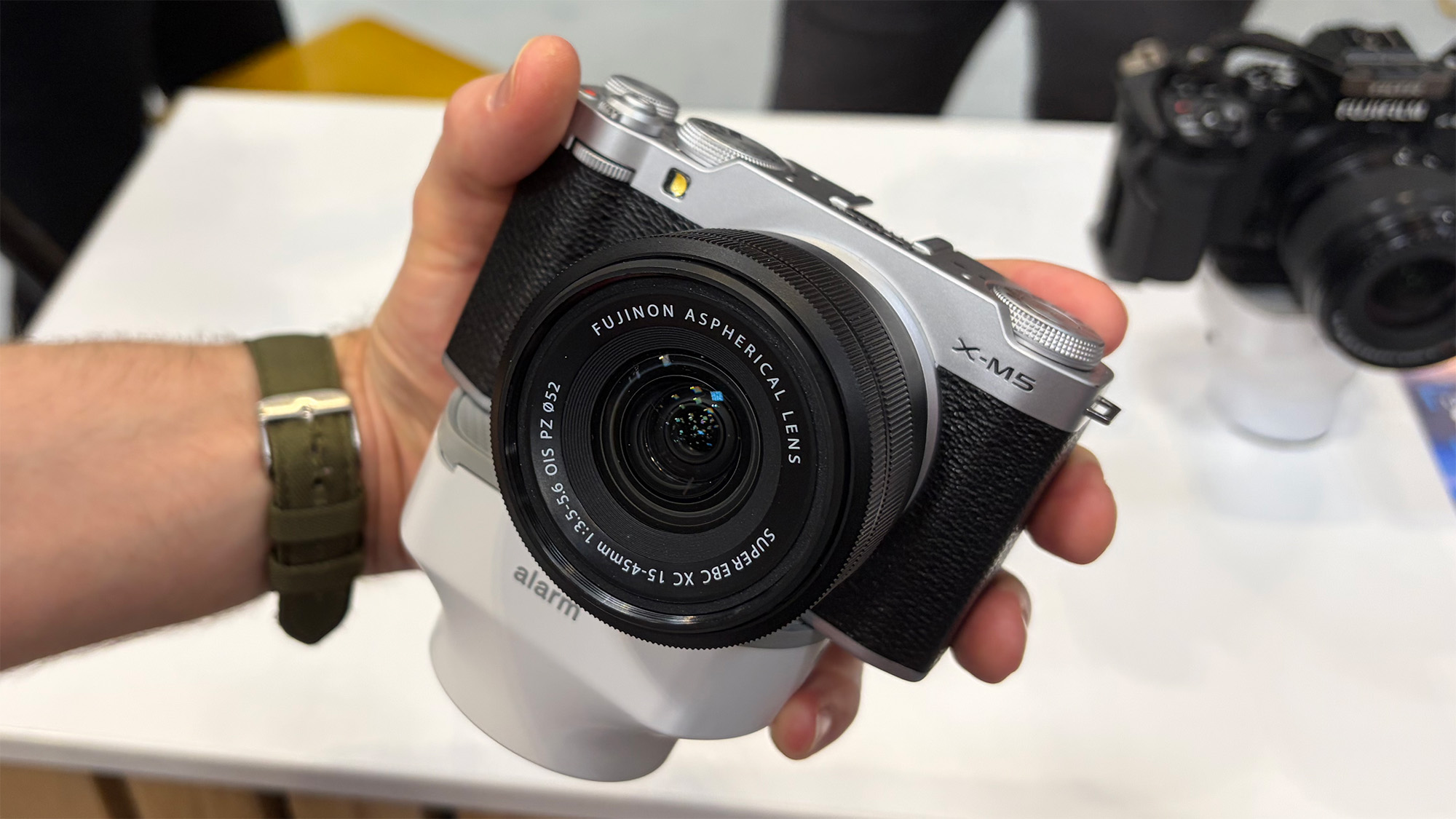 Mike Harris handling Fujifilm X-M5 on trade-show floor