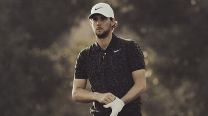 Thomas Pieters puts his glove on and stares into the distance
